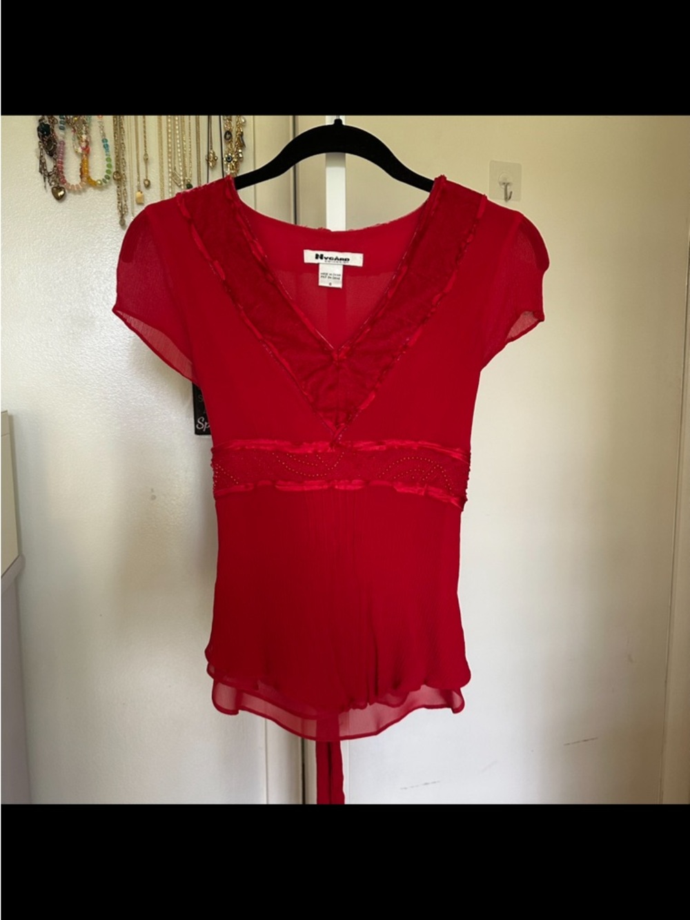 Red beaded blouse with velvet neckline and tie back